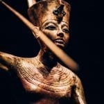 Gilded Wooden Figure of Tutankhamun on a Skiff, Throwing Harpoon - CREDIT IMG