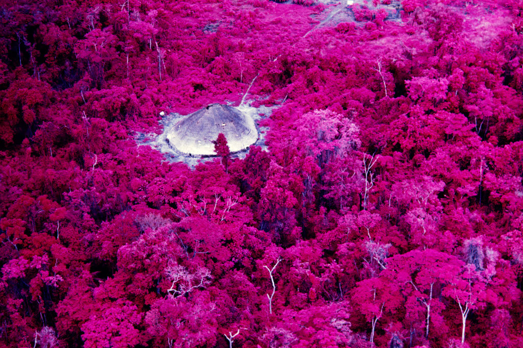 Collective house near the Catholic mission on the Catrimani River, Roraima, 1976. Infrared film. © Claudia Andujar