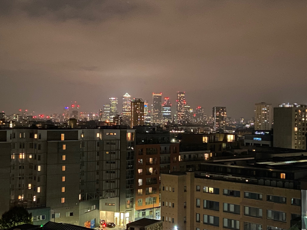 Canary Wharf appearing from the night sky