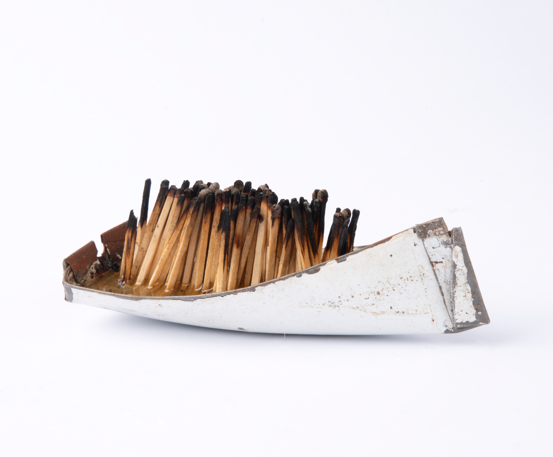 Issam Kourbaj, Dark Water, Burning World, 2016, Selection of small boats, made from recycled bicycle mud-guards, packed with upright burnt matches.  Photo: This Is Photography. Courtesy the artist. 